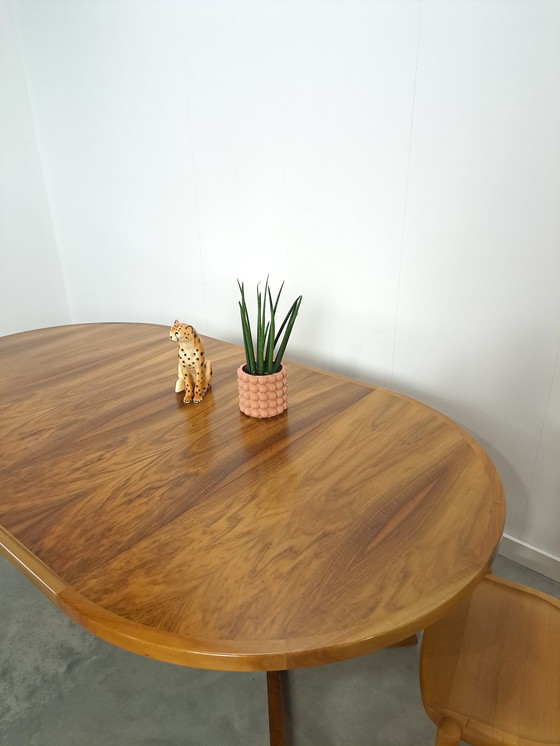 Image 1 of Large round walnut extendable dining table
