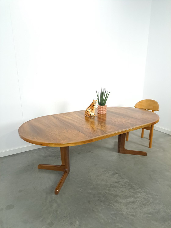 Image 1 of Large round walnut extendable dining table