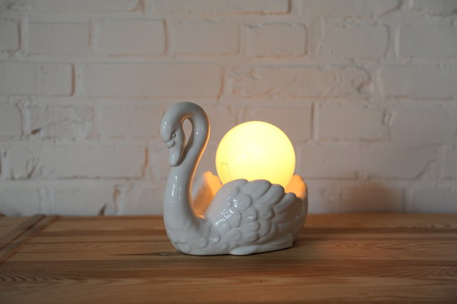 Sculptural porcelain table lamp in the shape of a swan