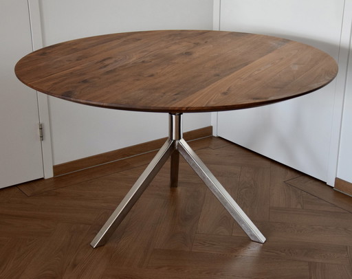 Dining table with stainless steel base