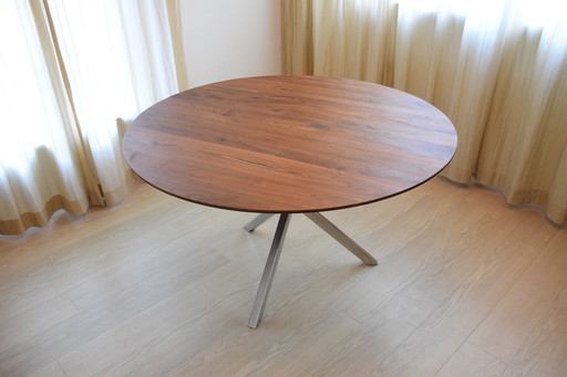 Dining table with stainless steel base