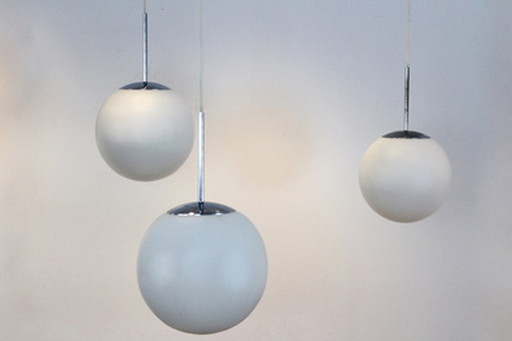 Peill & putzler chrome and opal glass bubble pendants, designed by wilhelm wagenfeld