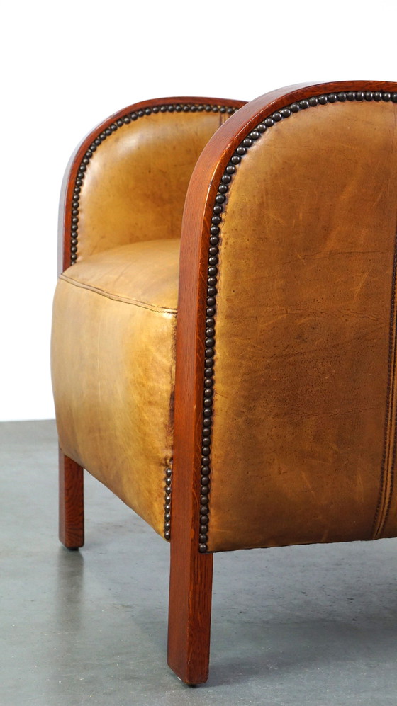 Image 1 of Fauteuil Artdeco en cuir avec accoudoirs en bois