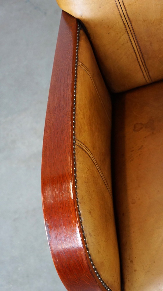 Image 1 of Fauteuil Artdeco en cuir avec accoudoirs en bois