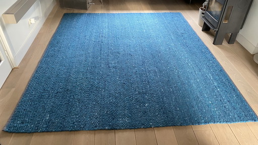 Tapis en laine Perletta de couleur pétrole