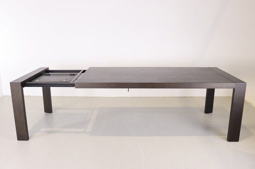 Arco Extenso dining table in black oak