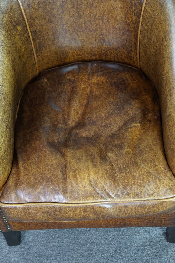 Image 1 of Leather club chair with decorative studs