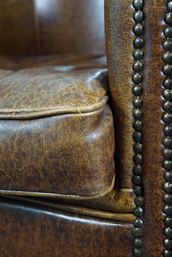 Image 1 of Leather club chair with decorative studs