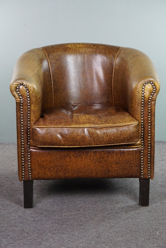 Image 1 of Leather club chair with decorative studs