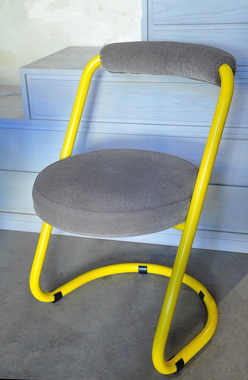 2 Yellow Metal Chairs