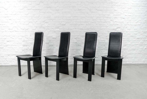 4 Mid-Century black saddle leather dining room chairs with high backrest in the style of Cidue