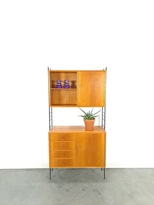 Modular Standing Wall Rack With Cabinets With Drawers And Black Steel Holders