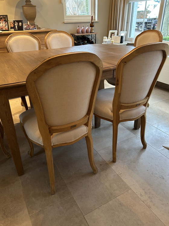 Image 1 of Solid Table With 4 Chairs And 2 Seat Chairs