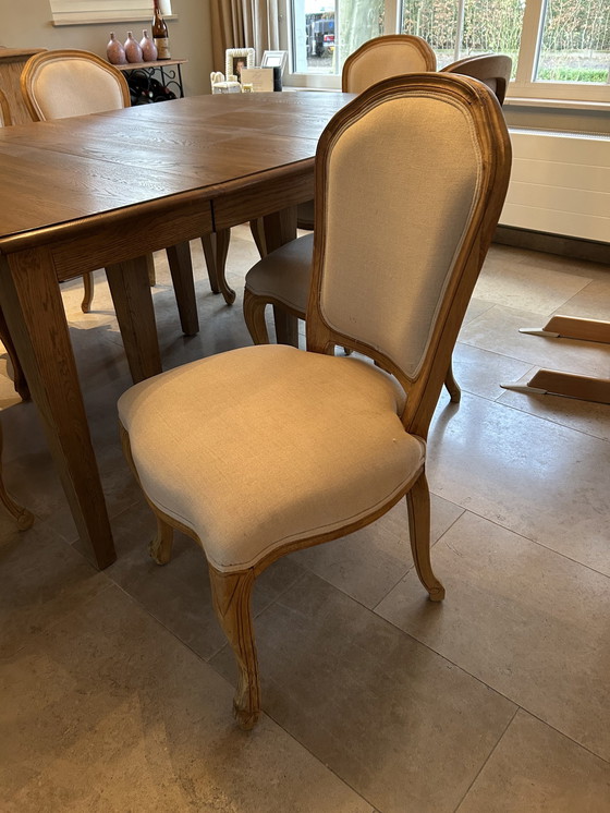 Image 1 of Solid Table With 4 Chairs And 2 Seat Chairs