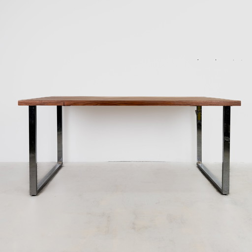 Solid teak table with chrome-plated frame