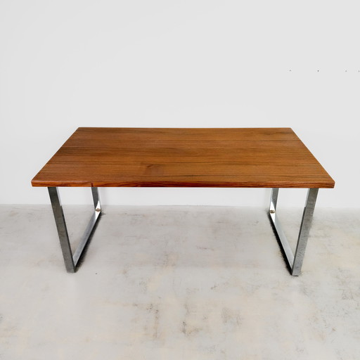 Solid teak table with chrome-plated frame