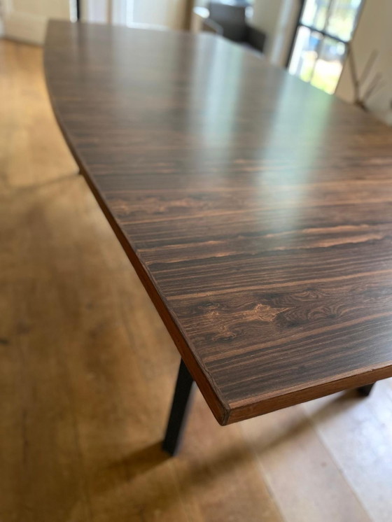 Image 1 of Mid - Century rosewood veneer dining table with steel legs