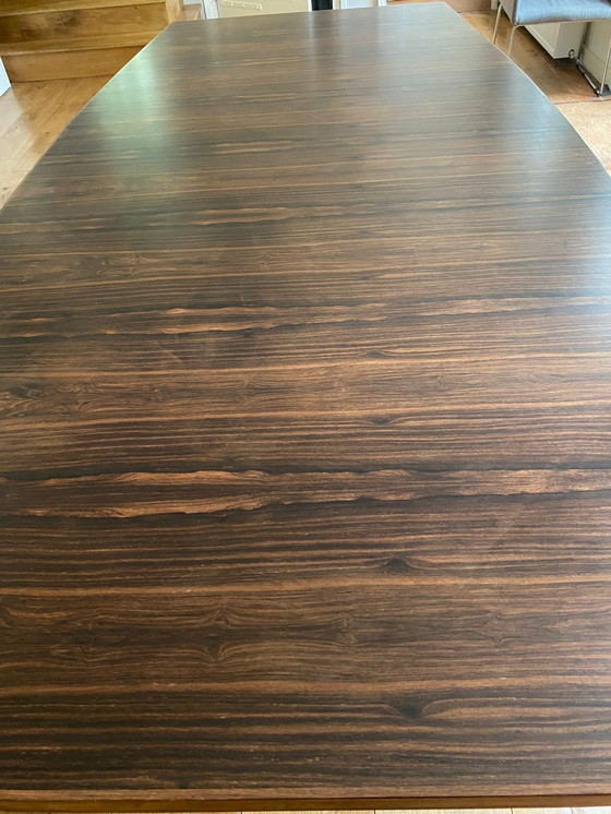 Image 1 of Mid - Century rosewood veneer dining table with steel legs