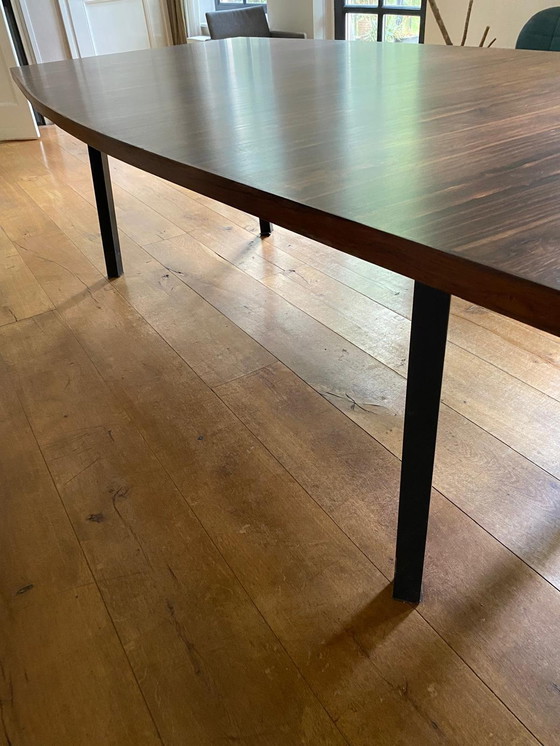 Image 1 of Mid - Century rosewood veneer dining table with steel legs