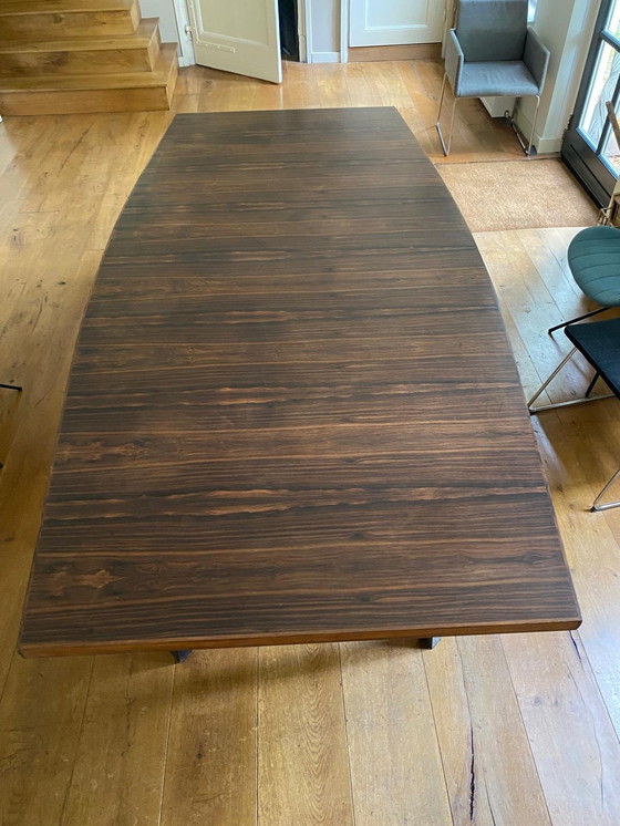 Image 1 of Mid - Century rosewood veneer dining table with steel legs