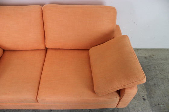 Image 1 of Cor Conseta Couch two-seater designer sofa orange fabric chrome runner
