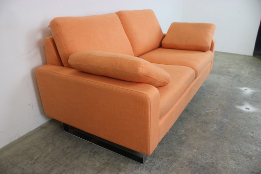 Cor Conseta Couch two-seater designer sofa orange fabric chrome runner