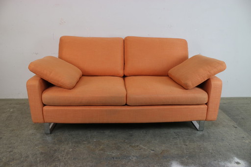 Cor Conseta Couch two-seater designer sofa orange fabric chrome runner