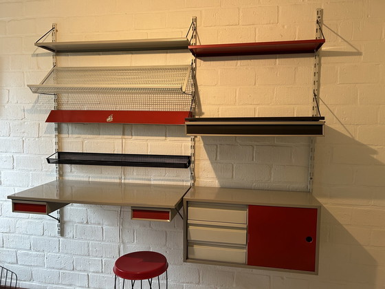 Image 1 of The Image Shows A Pilastro Wall Unit, A Design By Tjerk Reijenga From The 1950s, Against A Brick Wall.