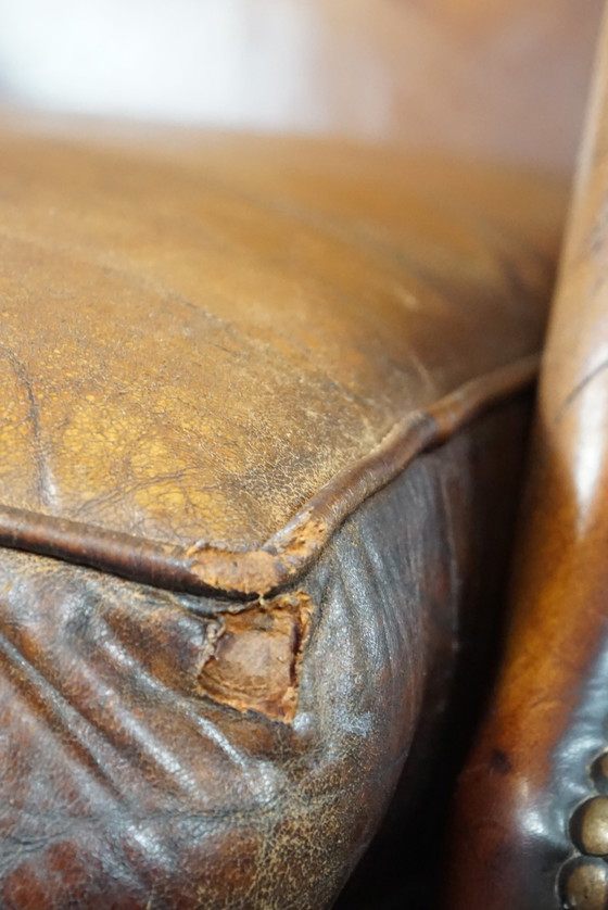 Image 1 of Sheep leather wing armchair with patina