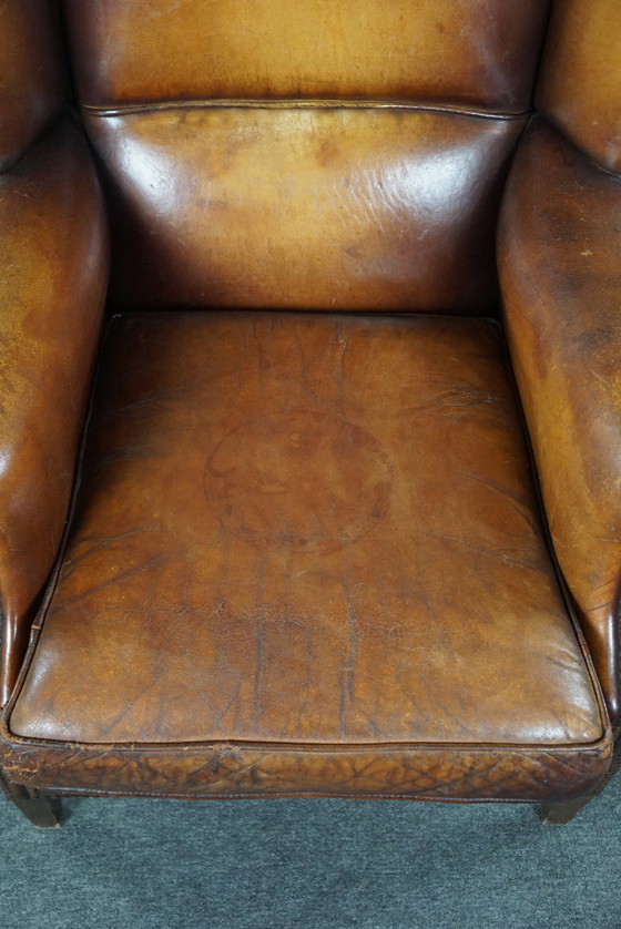 Image 1 of Sheep leather wing armchair with patina