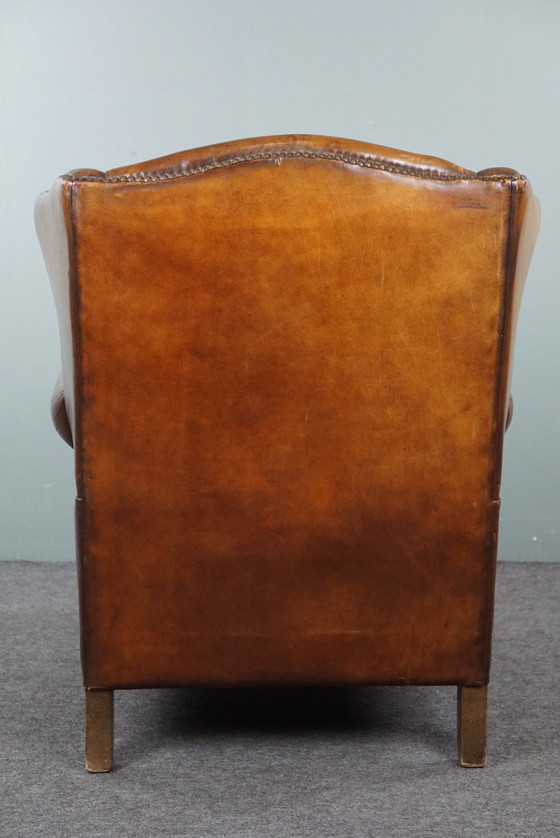 Image 1 of Fauteuil à oreilles en peau de mouton patiné