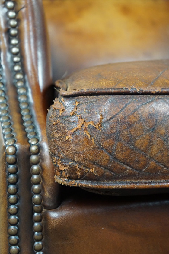 Image 1 of Sheep leather wing armchair with patina