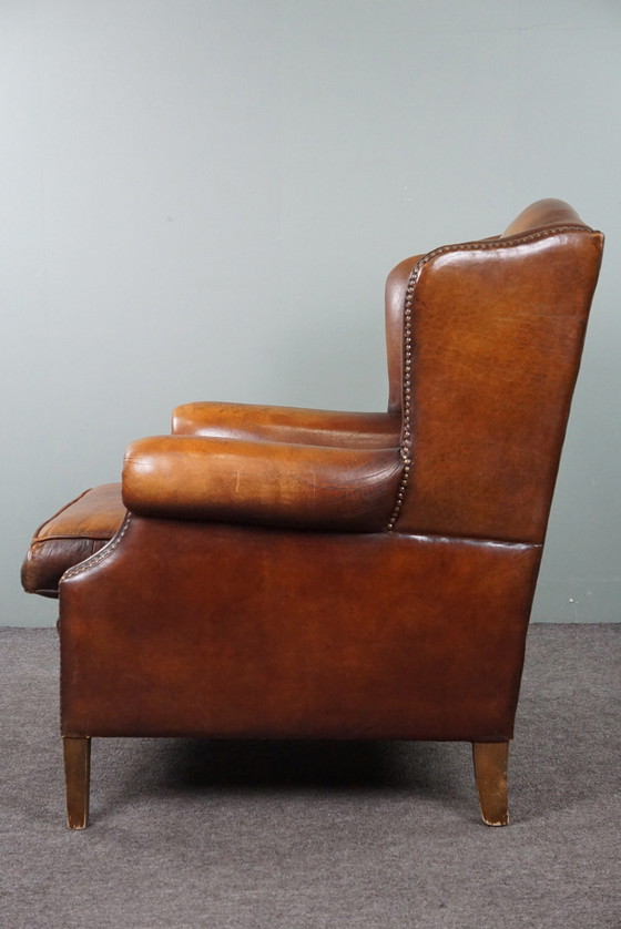 Image 1 of Sheep leather wing armchair with patina