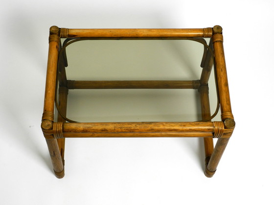 Image 1 of Beautiful 1970s dark bamboo wood couch or side table with smoked glass top