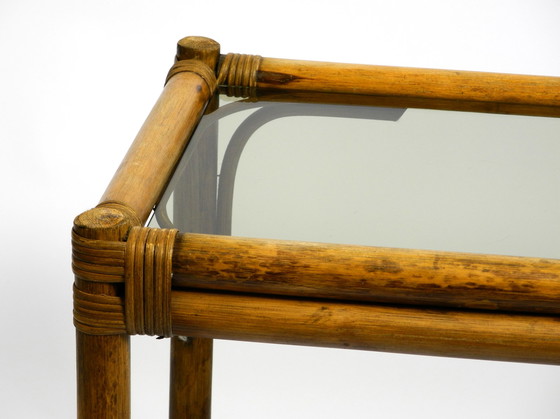 Image 1 of Beautiful 1970s dark bamboo wood couch or side table with smoked glass top