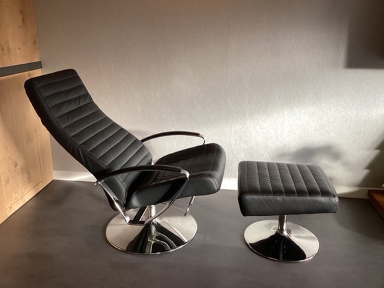 Image 1 of BoConcept Wing swivel armchair with footstool