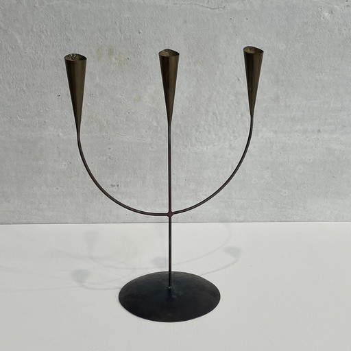 brass three-arm candelabra