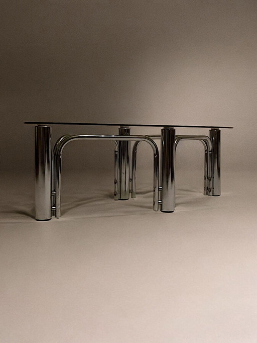 C. 1970 - Table Basse En Chrome Et Plateau En Verre Fumé De Forme Ovoïde - (Chrome and Smoked Glass Oval Coffee Table)