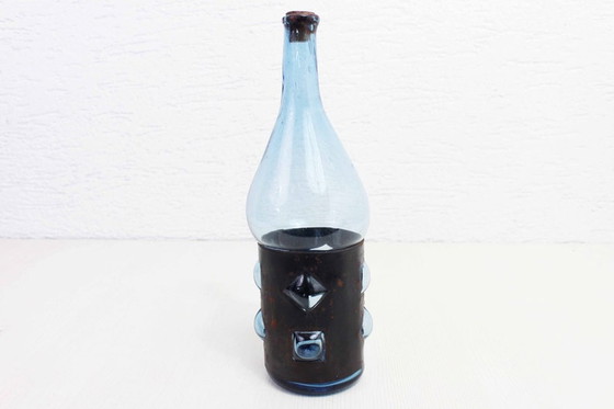 Image 1 of Blown glass and metal bottle by Felipe Derflingher. 1960