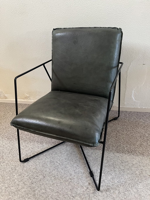 Fauteuil militaire en cuir vert