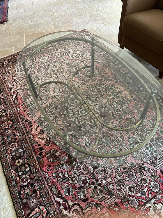 Image 1 of Glass oval coffee table with brass legs