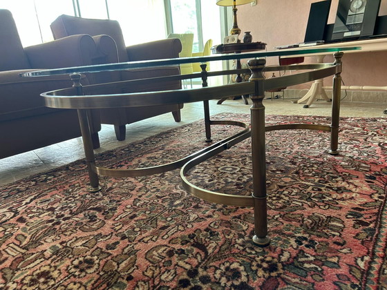 Image 1 of Glass oval coffee table with brass legs