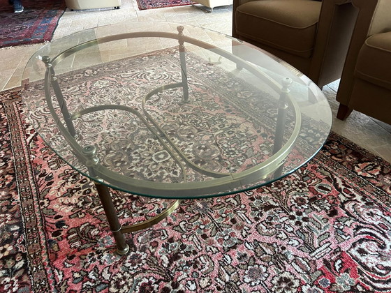 Image 1 of Glass oval coffee table with brass legs