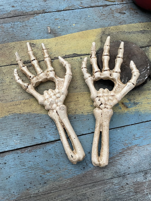 Set Of Two Cast Iron Bottle Openers Shaped Like Skeleton Hands