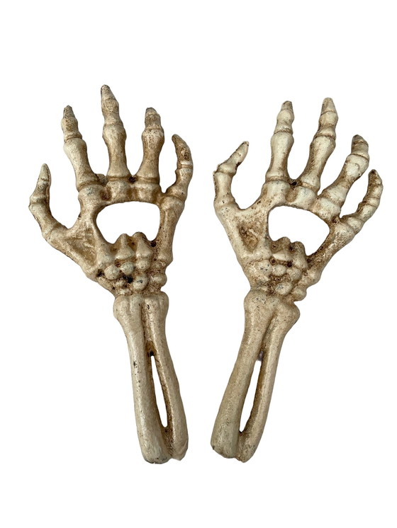 Image 1 of Set Of Two Cast Iron Bottle Openers Shaped Like Skeleton Hands