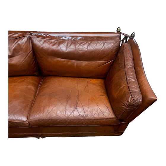 Image 1 of Comfortable sofa made of genuine leather with signs of wear