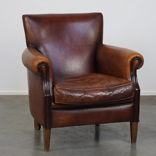 Fauteuil en cuir de mouton marron