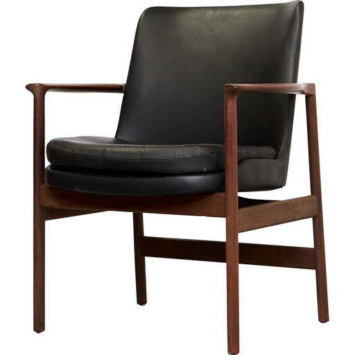 Vintage armchair in solid wood and black leather by Ib Kofod Larsen for Fröscher