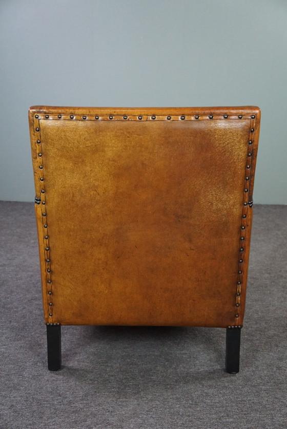 Image 1 of Art Deco armchair with black piping and decorative nails