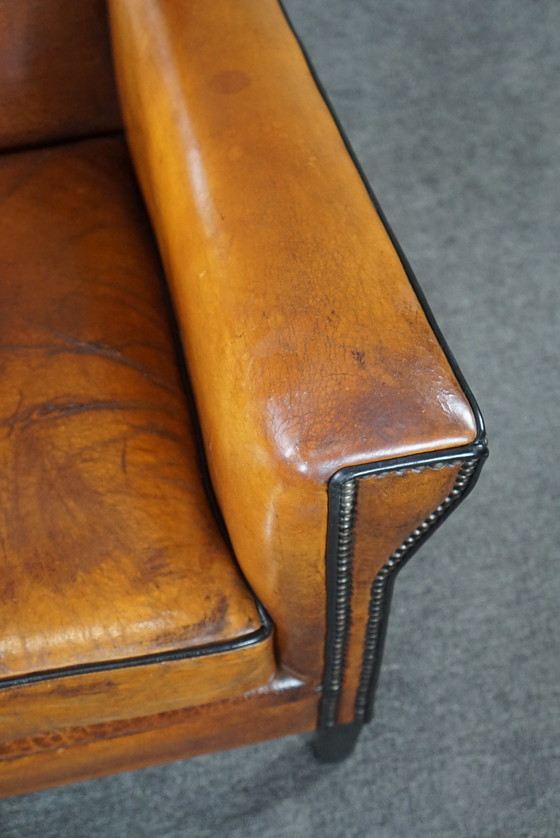 Image 1 of Art Deco armchair with black piping and decorative nails